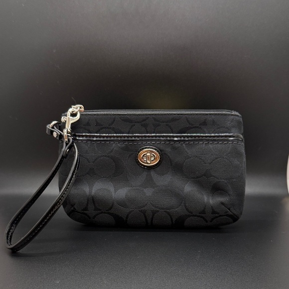 Coach Handbags - Coach Signature Black Turnlock Wristlet